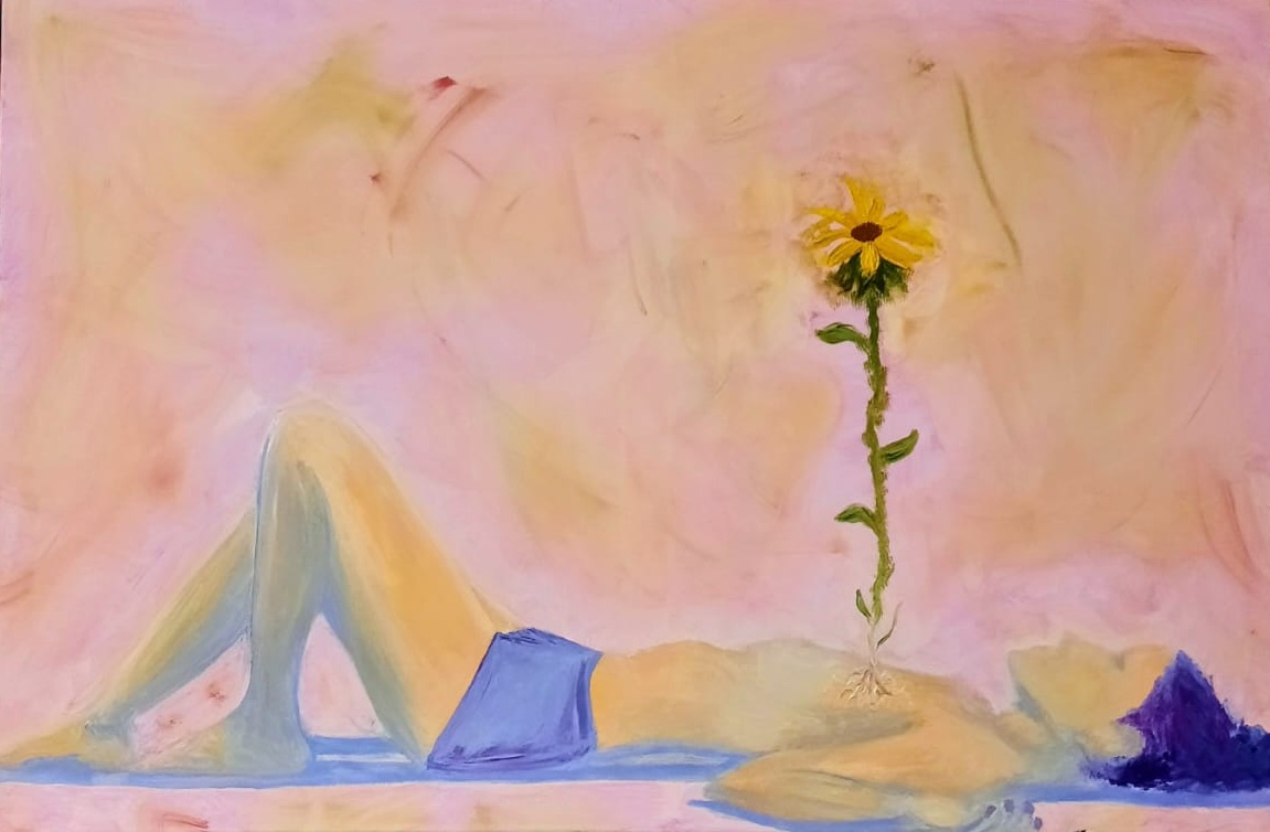 Person lying on their back with legs bent, wearing blue shorts, a sunflower on a long stem nearby, pink background.