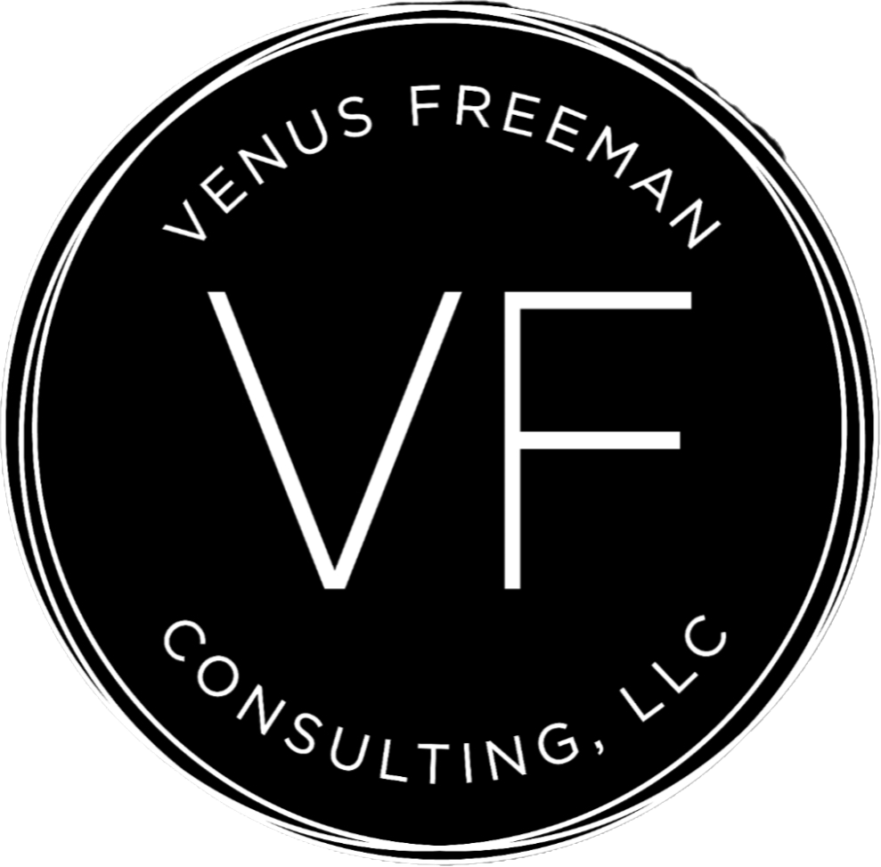 Black circular logo with white text reading 'Venus Freeman Consulting, LLC' and initials 'VF' in the center.