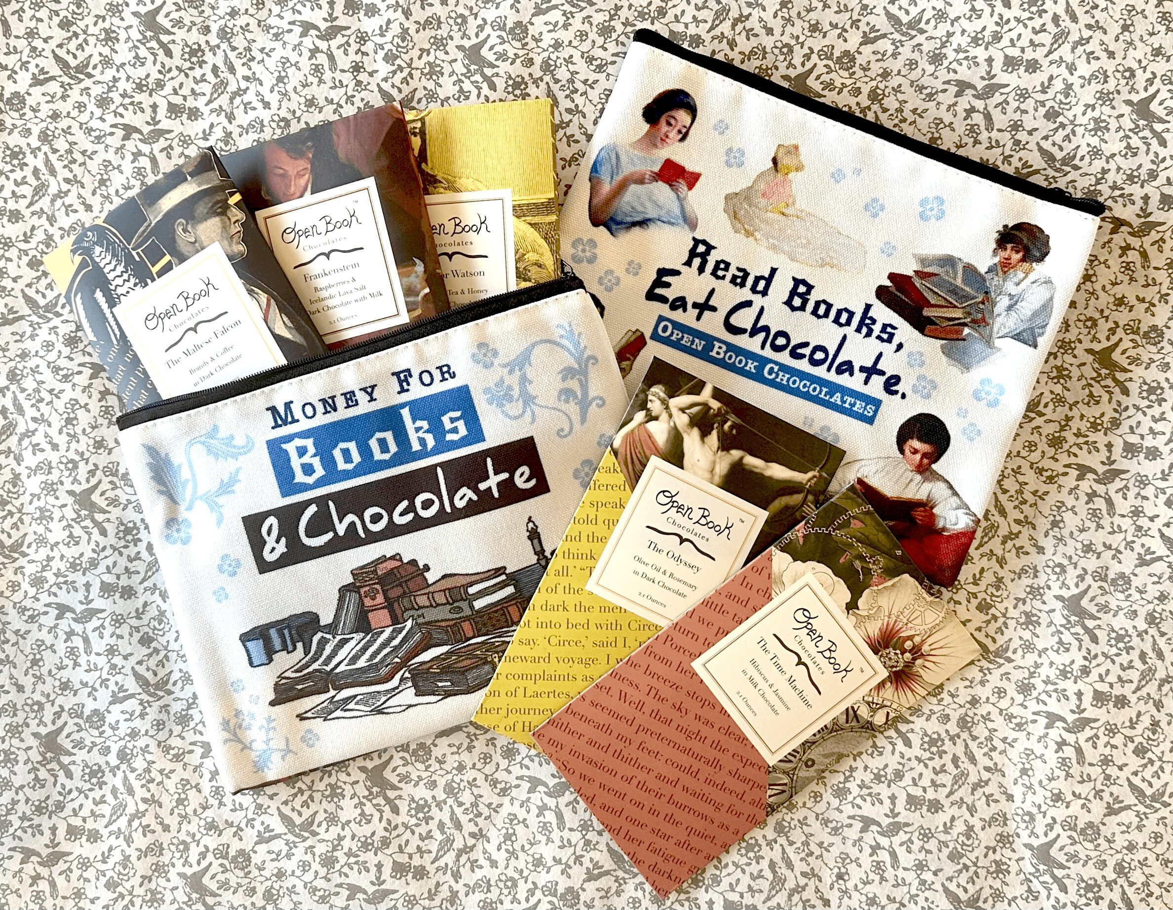 Books and pamphlets about reading books and eating chocolate, with illustrations of children and a bridge, on a speckled surface.