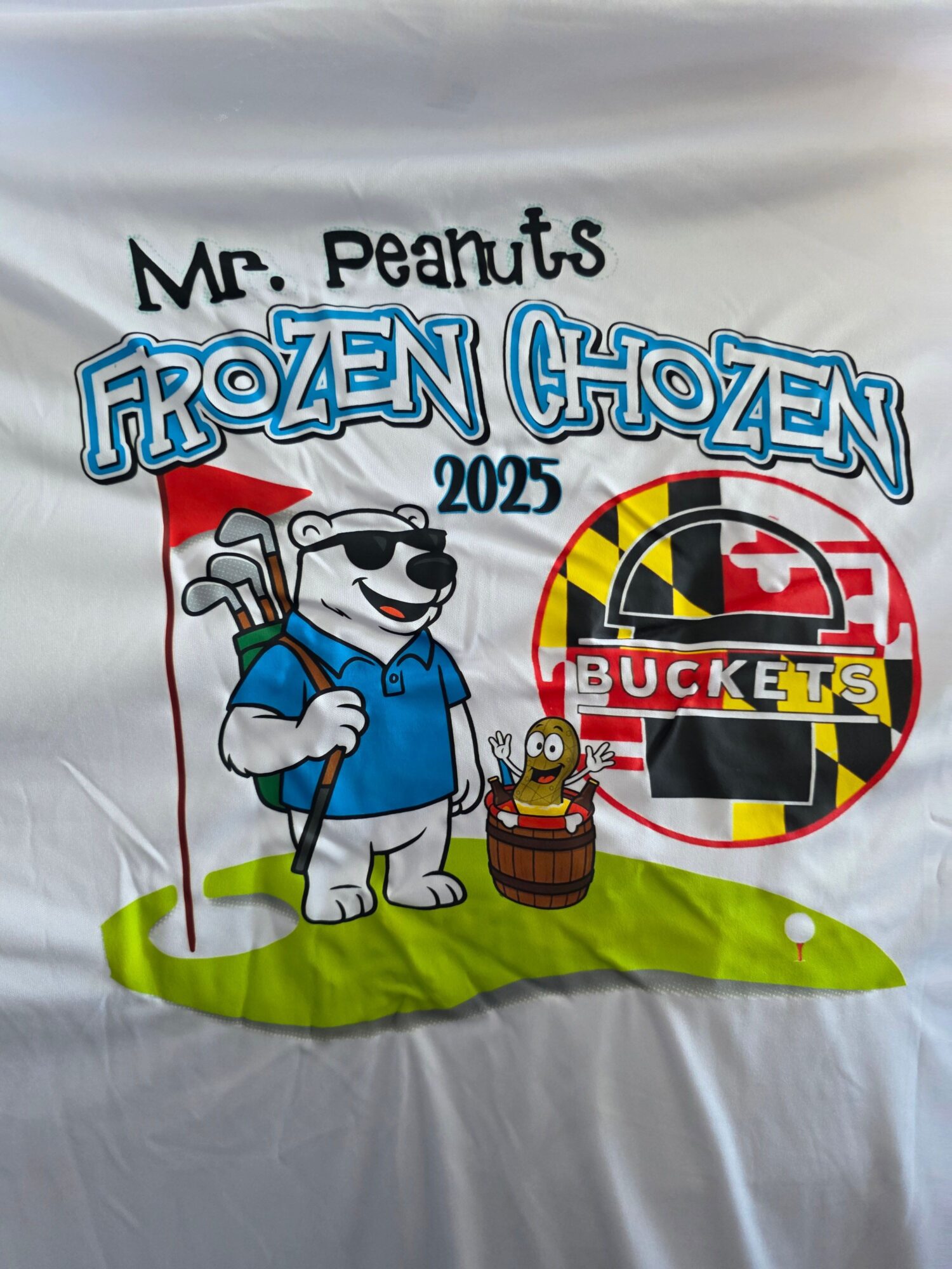 White fabric with Peanuts characters and logos, including Mr. Peanuts and a hockey puck, in a cartoon style.