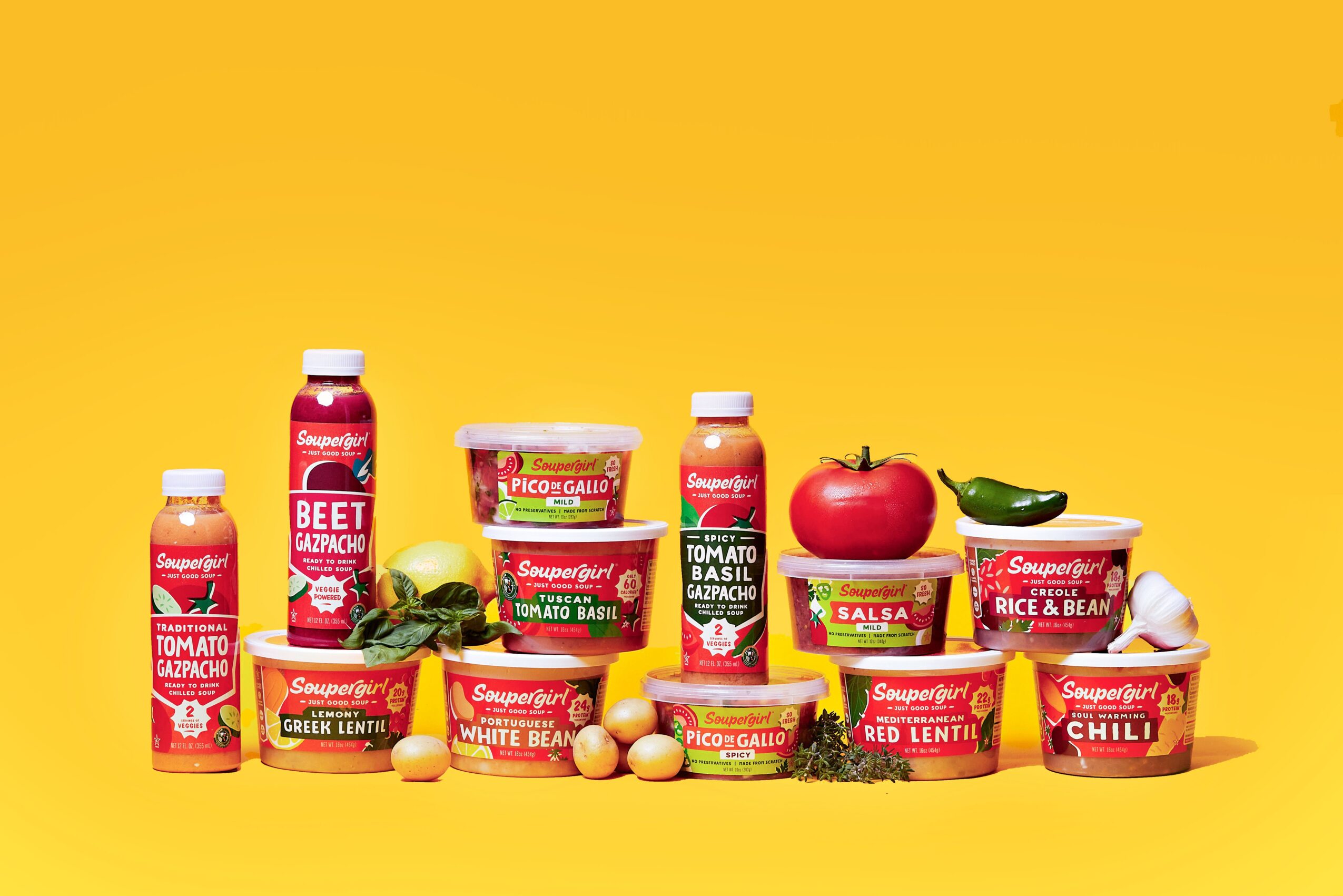 Assorted food products, vegetables, and sauces on a yellow background.