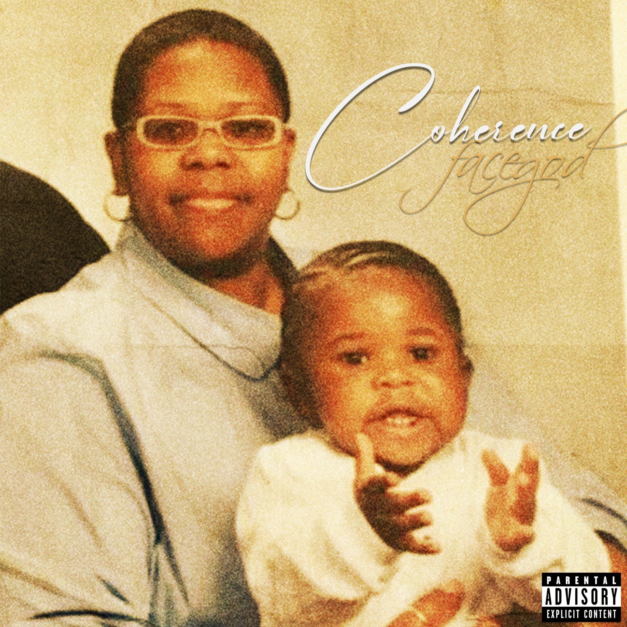 Woman with glasses and earrings holding a young child, both smiling, in a neutral background.
