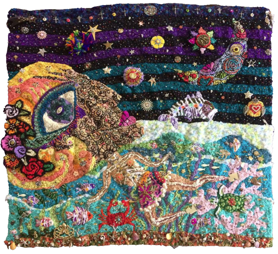 Colorful embroidered scene of a person lying on a beach with a starry night sky, planets, and celestial objects above.