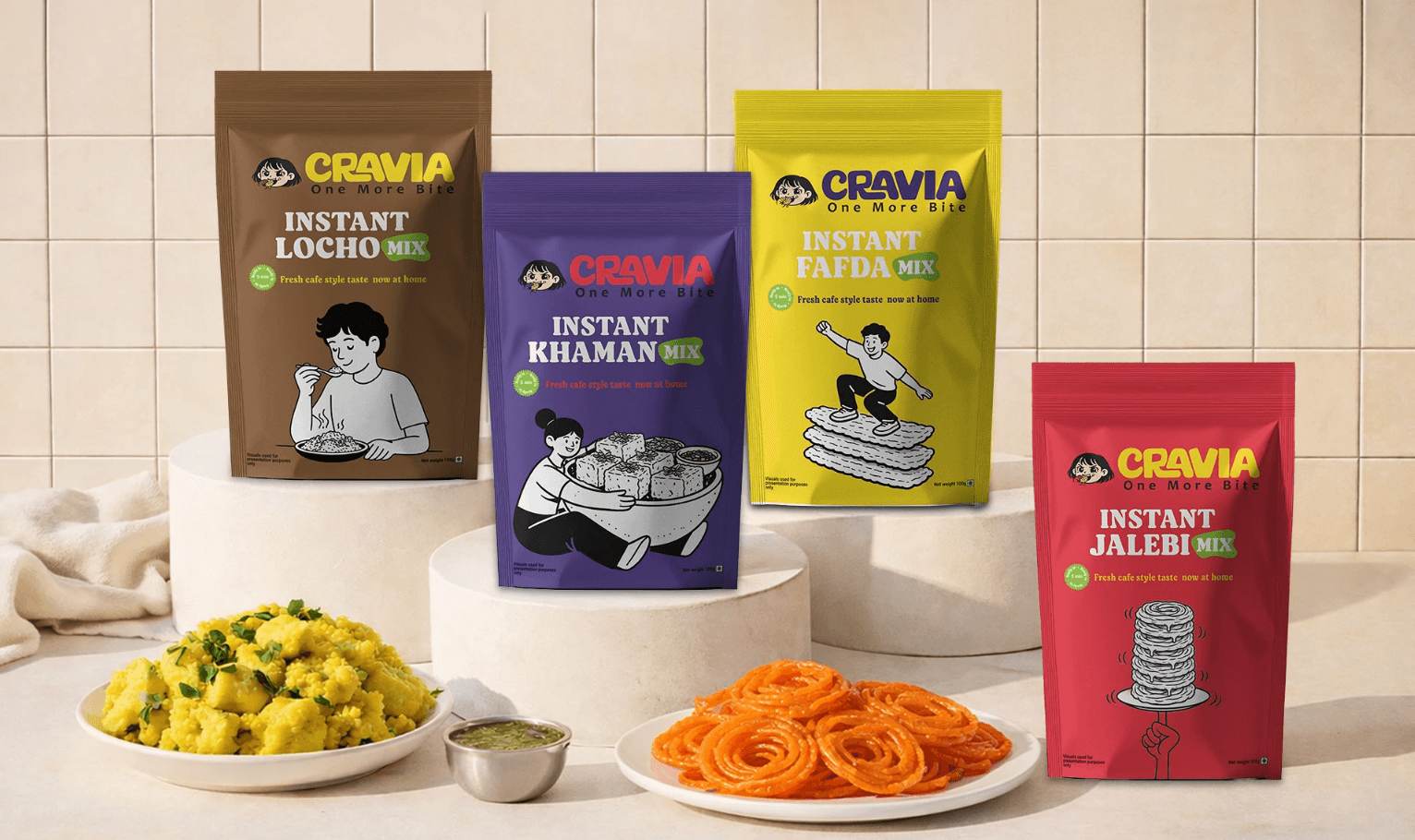 Four packets of instant food products, a plate of yellow snack, a plate of orange snack, and a small bowl on a white surface.