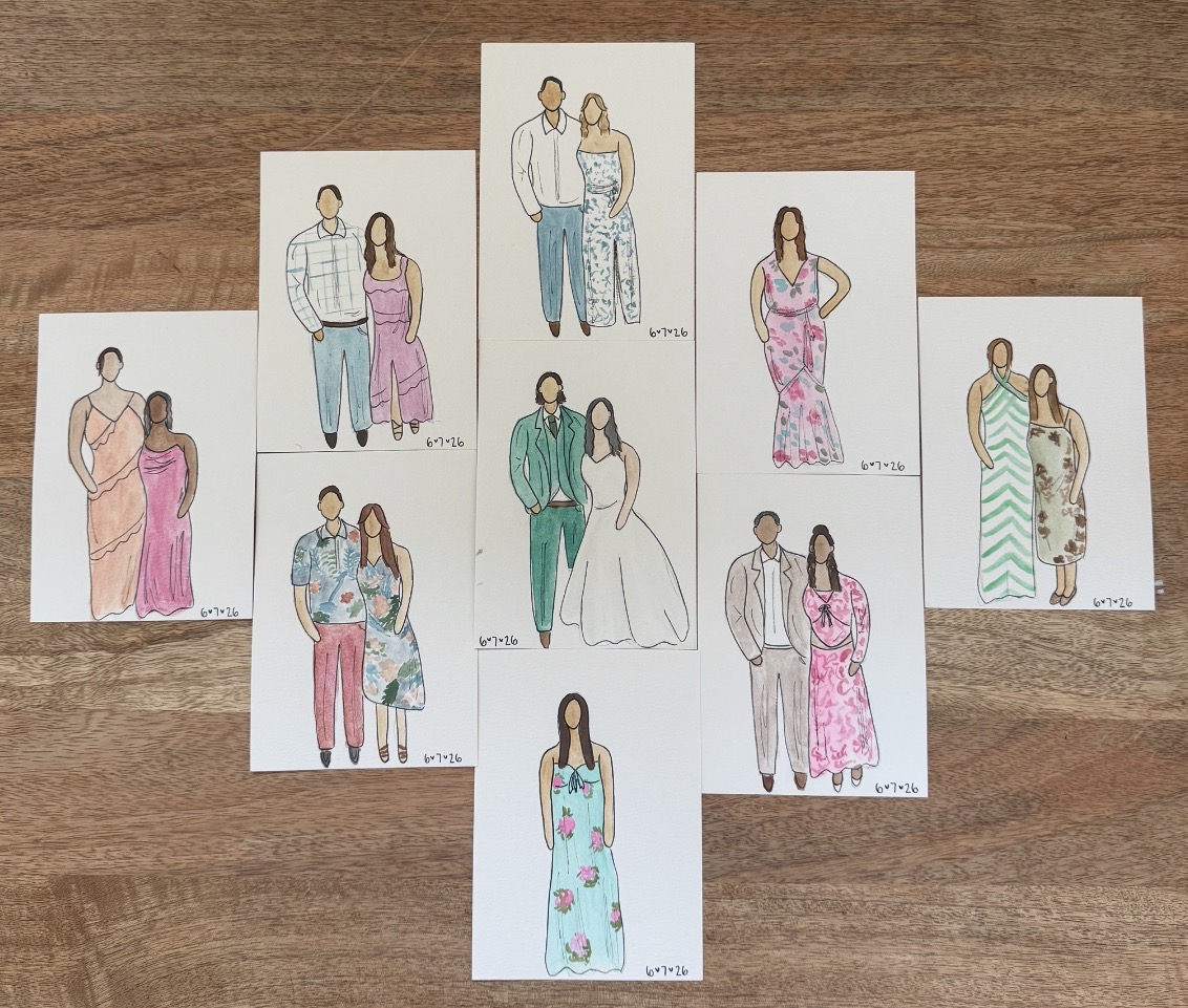 Collection of hand-drawn fashion illustrations of women in various dresses and outfits, arranged on a wooden surface.