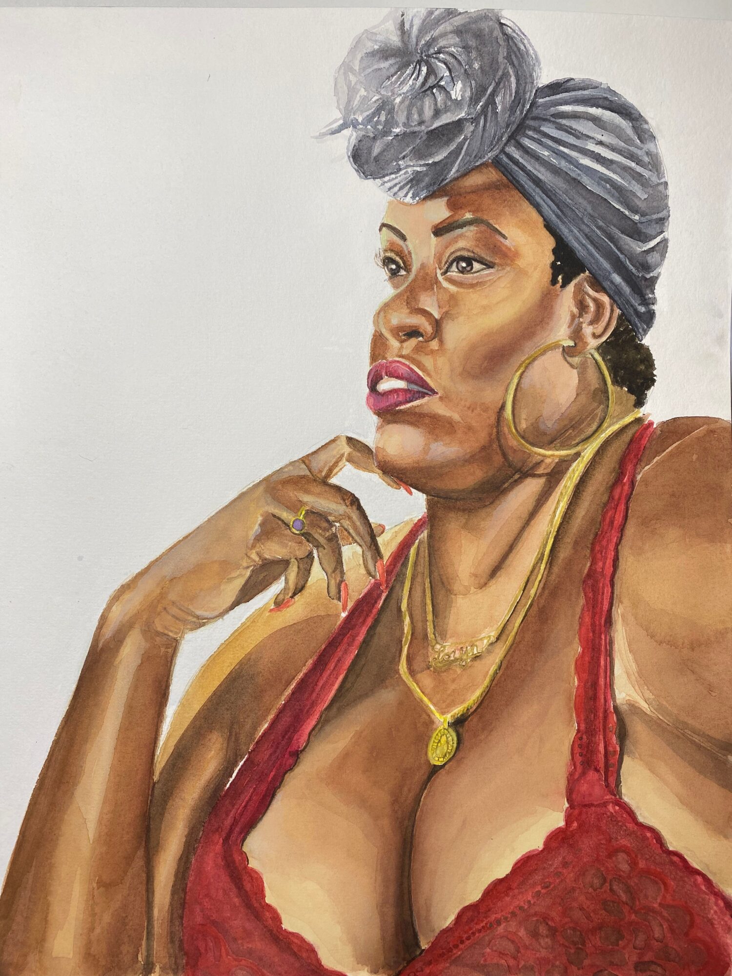 Portrait of a woman with gray hair, wearing large hoop earrings, a red lace top, and gold jewelry, looking sideways.