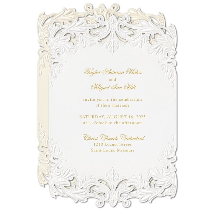 Elegant white wedding invitation with intricate border design, gold text, and details of the event and location.