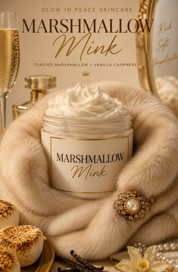 Open jar of marshmallow mink skincare cream surrounded by fur, pearls, and flowers, with packaging in the background.