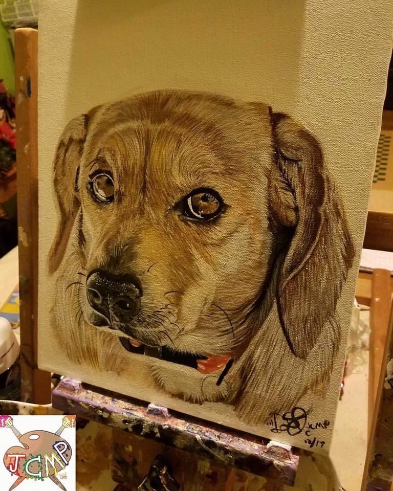 Close-up of a dog's face with detailed fur and expressive eyes, on a canvas or paper, signed at the bottom right.