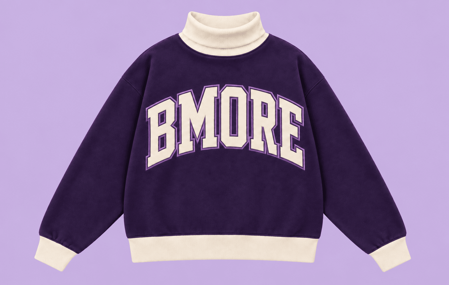 Purple sweatshirt with white collar and cuffs, and large white text reading 'BMORE' on the front.