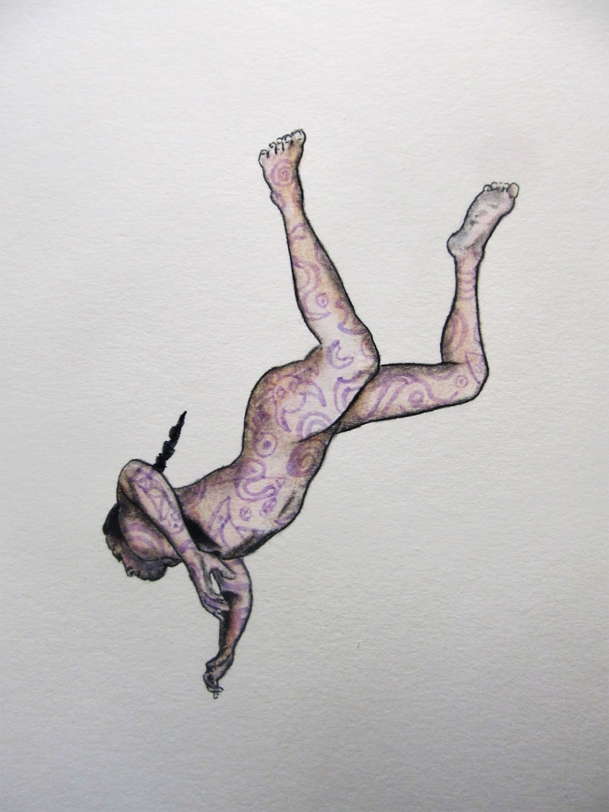 A person with a hat and patterned clothing is upside down, hanging with legs in the air and head downward.
