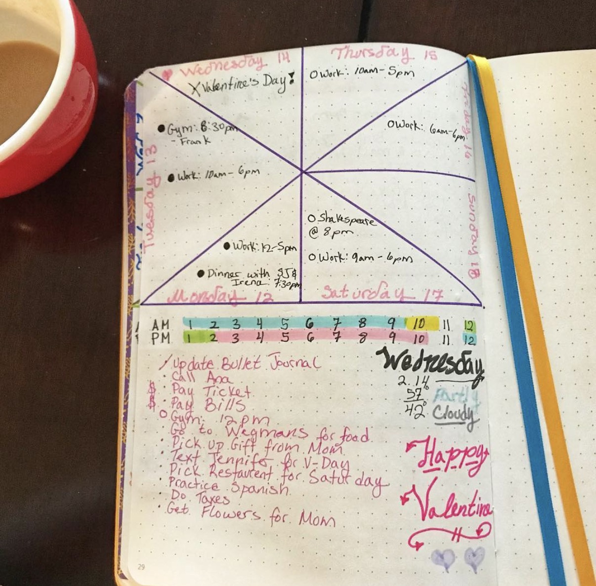 Open notebook with handwritten schedule and notes, colorful tabs, and a Valentine's Day message, on a wooden surface.
