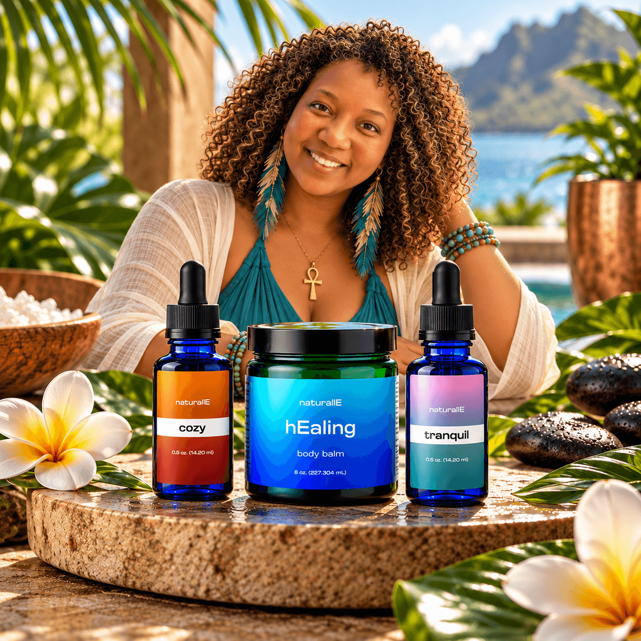 Smiling person behind three wellness product bottles on a tropical outdoor table, with flowers, plants, and water in the background.