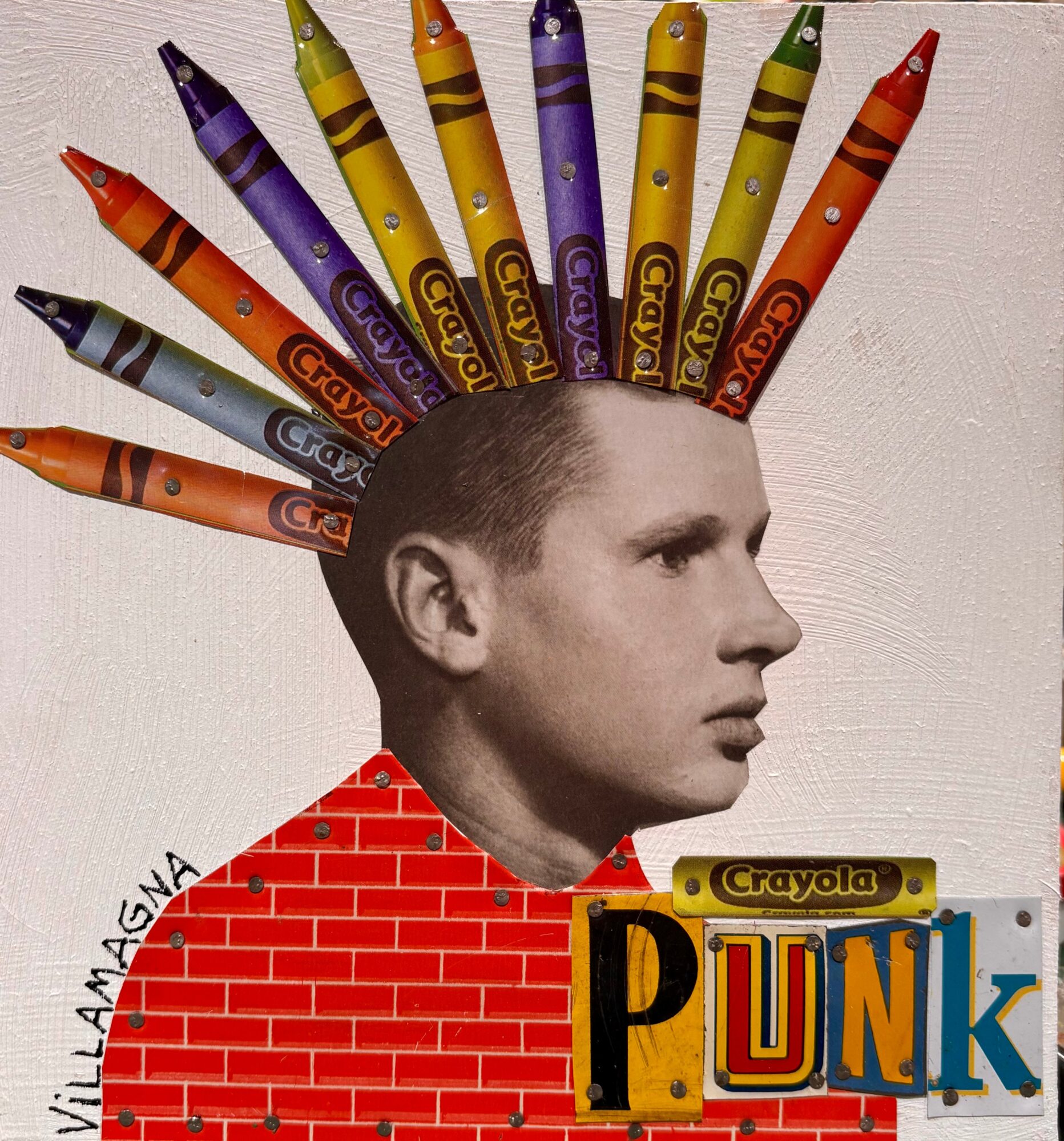 Collage of a man's profile with colorful crayons arranged like a fan, above a red brick wall and the word “PUNK.”