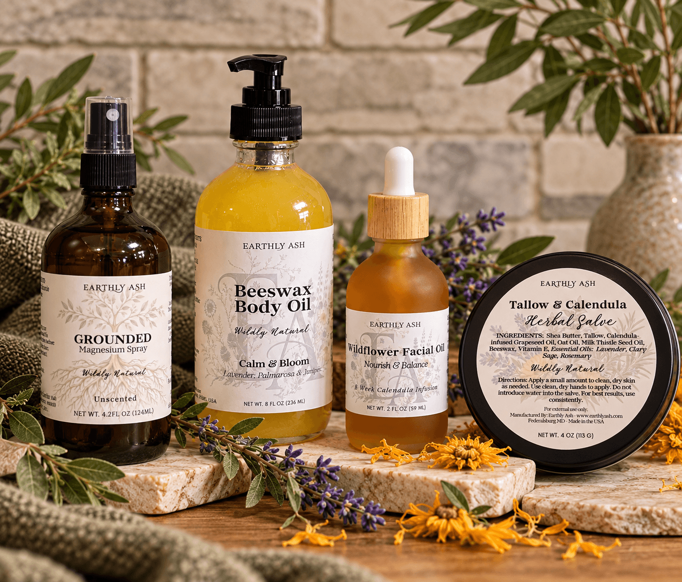 Four natural skincare products arranged on stone blocks among leaves and flowers.